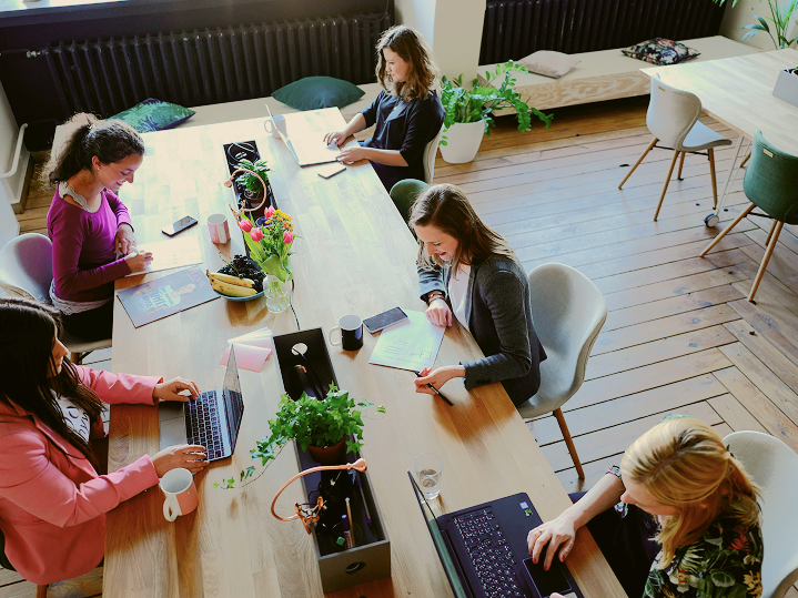 Group of women working as a team in office